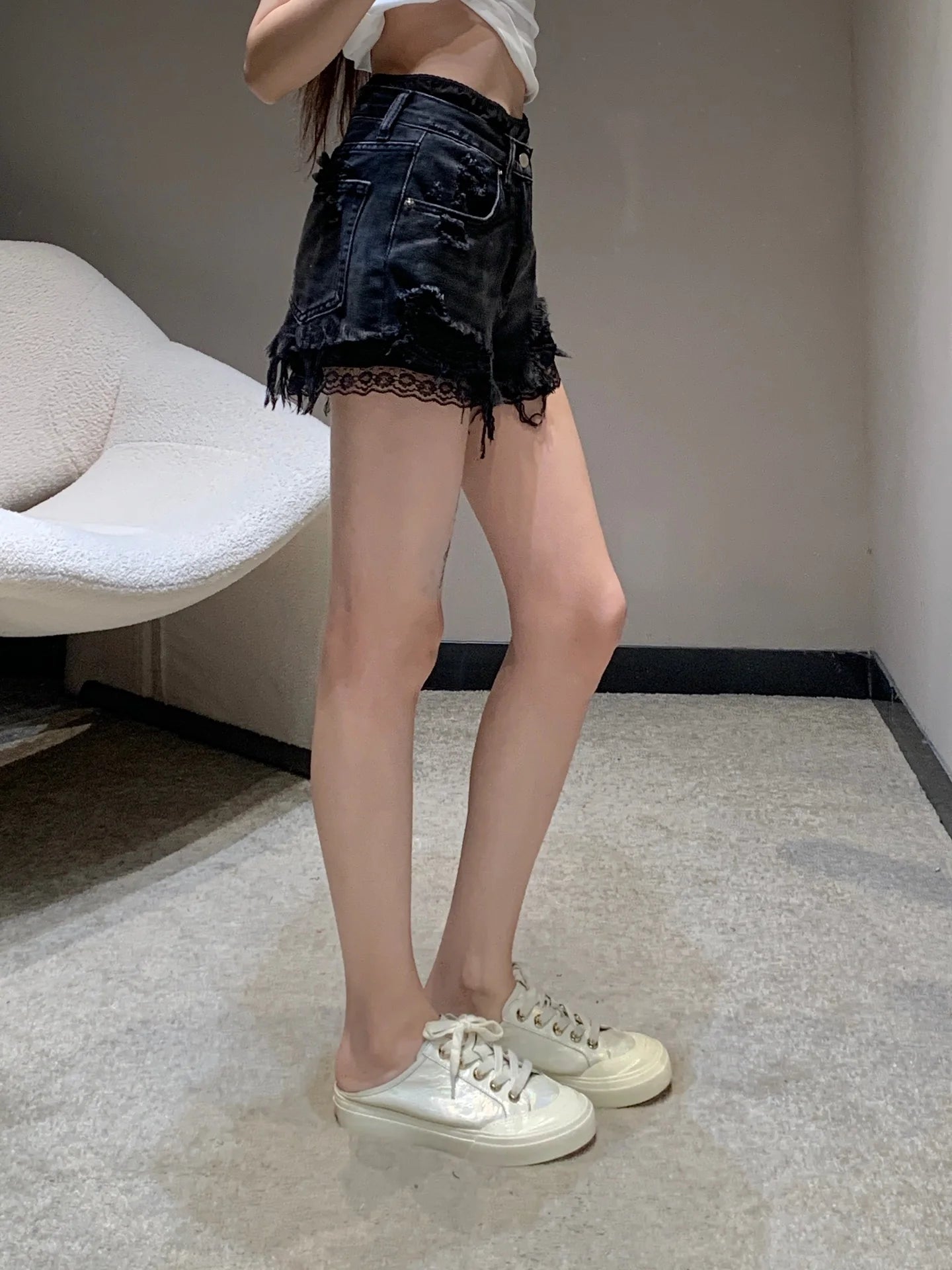 Fake two-piece lace-lined ripped denim shorts