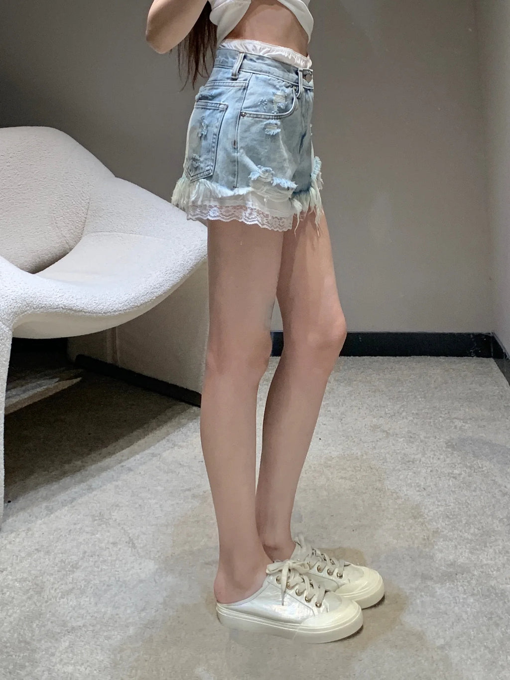 Fake two-piece lace-lined ripped denim shorts