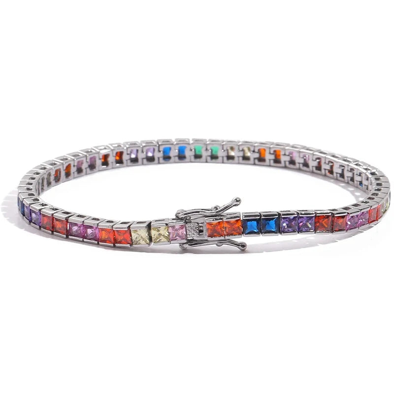 A dazzling 14K gold tennis bracelet adorned with rainbow-shaped cubic zirconia, the perfect gift for special occasions.